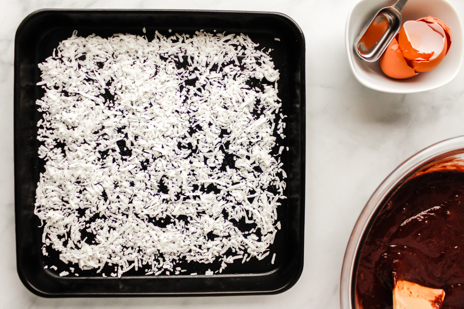 shredded coconut on a baking dish